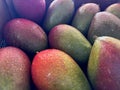ripe mango displayed on market table, showcasing fresh tropical fruit ready for purchase. Royalty Free Stock Photo