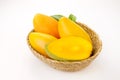 Ripe mango fruit with leaf in basket on white background Royalty Free Stock Photo