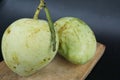 Ripe mango on wooden table. Tropical fruit. Two fresh mango. Ripe green mangoes on wooden background Royalty Free Stock Photo