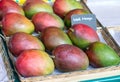 Ripe Mangos in a Box on Market. Exotic Fresh Fruits Royalty Free Stock Photo