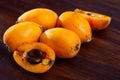 Ripe medlar fruits nispero on wooden surface Royalty Free Stock Photo