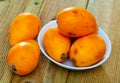 Ripe medlar fruits nispero on wooden surface Royalty Free Stock Photo