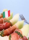 Ripe melon with ham, parmesan with Italy flag Royalty Free Stock Photo