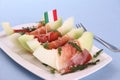 Ripe melon slice with ham, parmesan, Italy flag Royalty Free Stock Photo