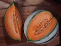 Ripe melon and slice of melon on a wooden board Royalty Free Stock Photo