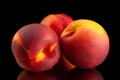 Ripe nectarine fruit on black