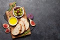 Ripe olives, figs, olive oil and ciabatta bread Royalty Free Stock Photo