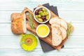 Ripe olives, olive oil and ciabatta bread Royalty Free Stock Photo