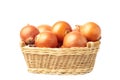 Ripe onions in basket isolated on a white background Royalty Free Stock Photo