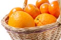 Ripe oranges and mandarines in basket