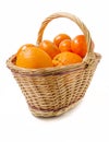 Ripe oranges and mandarines in basket