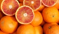 Ripe oranges and an orange cut in the stall of greengrocer Royalty Free Stock Photo