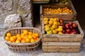 Ripe oranges, peaches, nectarines and plums in wooden boxes for sale Royalty Free Stock Photo