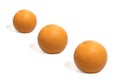 3 ripe oranges, placed in a diagonal corner line,