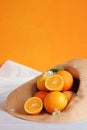 Ripe oranges in a summer hat. Summer composition Royalty Free Stock Photo