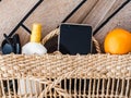 Ripe oranges, wicker basket, sunblock and sunglasses