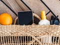 Ripe oranges, wicker basket and sunglasses. Top view