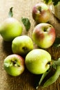 Ripe organic apples on the desk Royalty Free Stock Photo