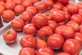 Ripe organic beefsteak tomatoes on metal tray at local market in Texas, America