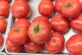 Ripe organic beefsteak tomatoes on metal tray at local market in Texas, America