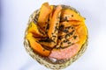 Ripe papaya in cane fruit basket on white background. Royalty Free Stock Photo
