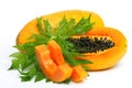 Ripe papaya with seeds and leaf