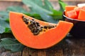 Ripe papaya slice on wood Royalty Free Stock Photo