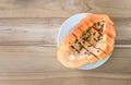 ripe papaya on wood table from above , ripe papaya health benefits.