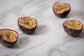 Ripe passion fruits line up in row on marble background