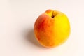 Ripe peach close-up on a white table Royalty Free Stock Photo