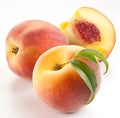 Ripe peach fruit with leaves and slises Royalty Free Stock Photo