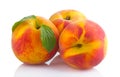 Ripe peach fruits with green leave isolated Royalty Free Stock Photo