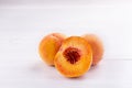 Ripe peaches close-up on a white wooden background Royalty Free Stock Photo