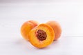 Ripe peaches close-up on a white wooden background Royalty Free Stock Photo