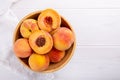 Ripe peaches close-up on a white wooden background Royalty Free Stock Photo
