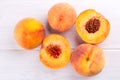 Ripe peaches close-up on a white wooden background Royalty Free Stock Photo