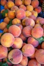 Ripe peaches, farmers market counter, harvest sale.