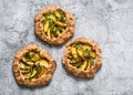 Ripe peaches, fresh thyme mini pies galettes - delicious summer pastry dessert on a grey background, top view Royalty Free Stock Photo