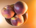 Ripe peaches on a light yellow background, top view Royalty Free Stock Photo