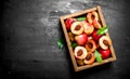 Ripe peaches in an old box. Royalty Free Stock Photo