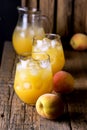 Ripe Peaches Tasty and Cold Peaches Juice Healthy Drink with Ice Cube Old Wooden Background Vertical Dark Photo Royalty Free Stock Photo