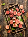 Ripe peaches on a tray. Royalty Free Stock Photo