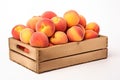 ripe peaches in wooden box isolated on white background Royalty Free Stock Photo