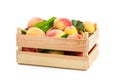 Ripe peaches in a wooden box Royalty Free Stock Photo