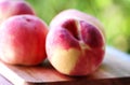 ripe peaches on wooden table Royalty Free Stock Photo