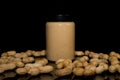 Ripe peanuts in husk and jar with peanutbutter