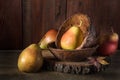 Ripe pear and a bunch of viburnum berries