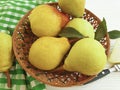 Ripe pear natural bio on a plate vitamin rustic harvest nutrition on a white wooden background