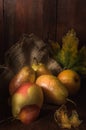 Ripe pears on a dark wooden background