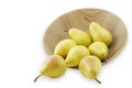 Ripe pears in a wooden bowl, isolated on white Royalty Free Stock Photo